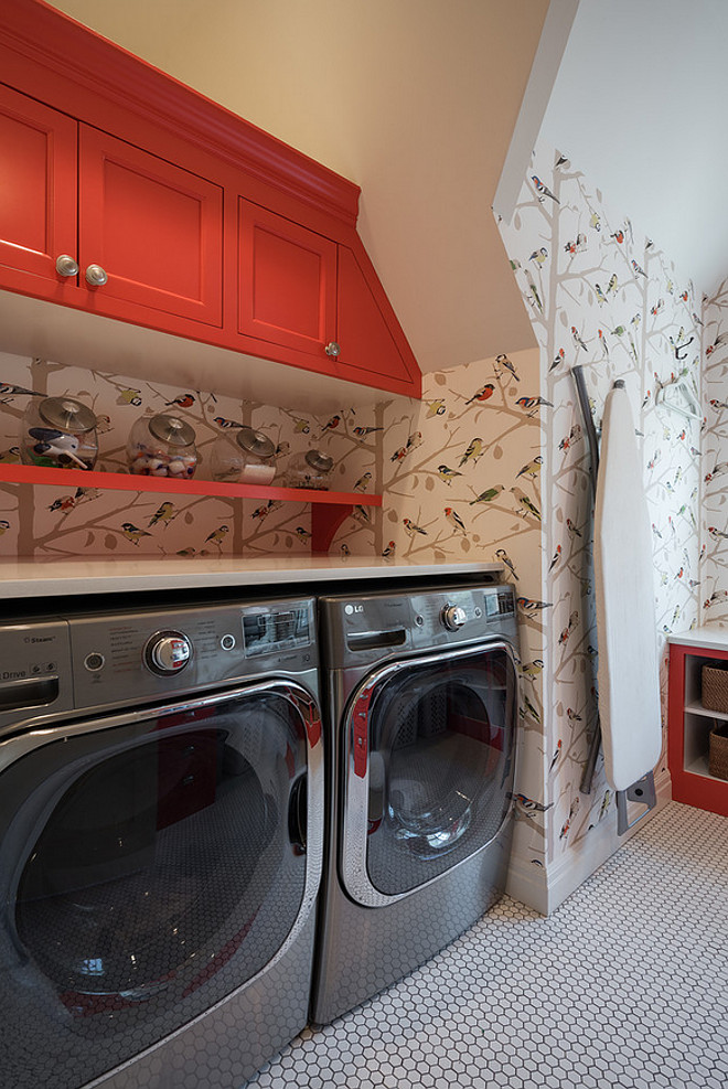 Red cabinet paint color. Laundry room with red cabinets. Laundry room with red cabinets and Schumacher paper A-Twitter wallpaper. #redcabinet #paintcoor #laundryroom Northstar Builders, Inc.