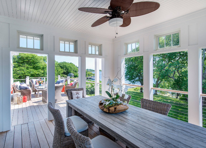 Four Seasons Sunroom. Screened in porch with outdoor dining area. Beadboard ceiling on screened in porch and stainless steel cable railing #screenedinporch #porch #screenedin #FourSeasons #Sunroom #Beadboardceiling Caldwell & Johnson Custom Builders & Remodelers