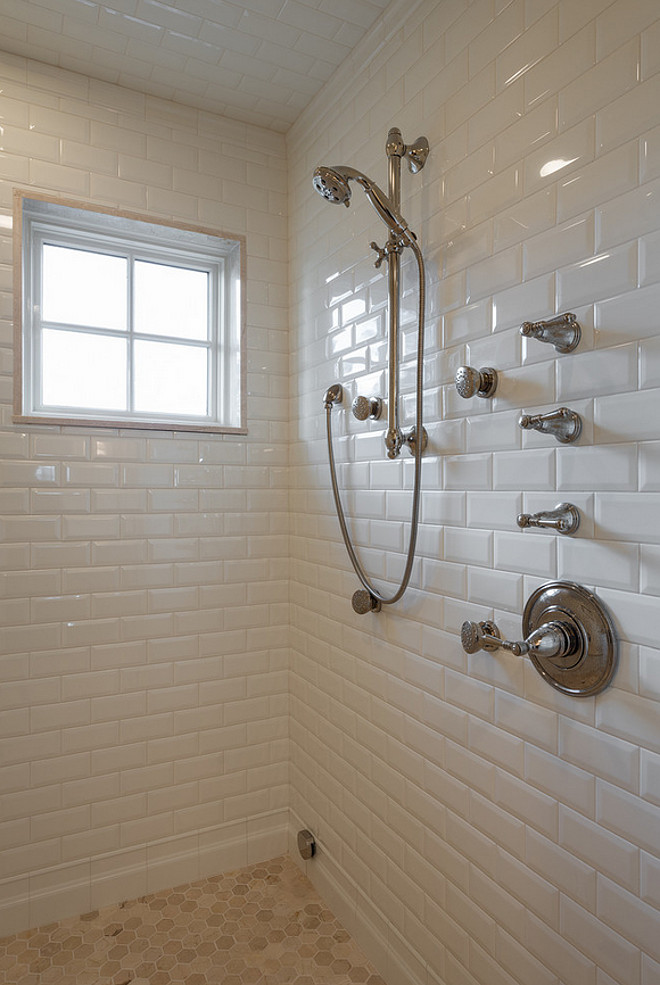 Shower features floor to ceiling beveled subway tiles and octagon marble tiles on floors. Marble slab surrounds shower window.. Marble slab surrounds shower window. Northstar Builders, Inc.