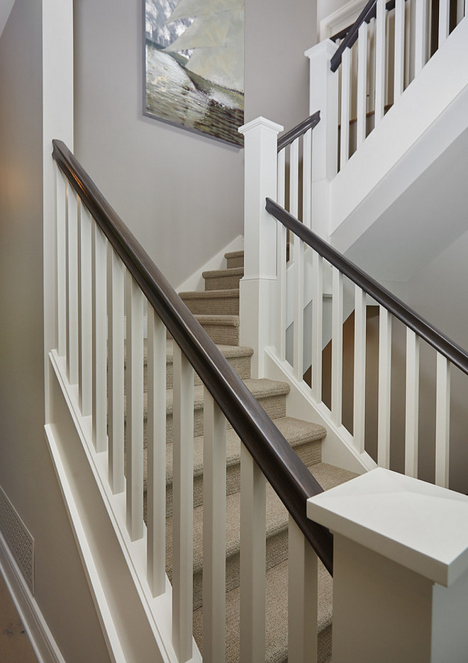 White staircase trim paint color. Benjamin Moore White Dove white staircase paint color. Staircase painted in Benjamin Moore White Dove. #BenjaminMooreWhiteDove #staircase #paintcolor #trim