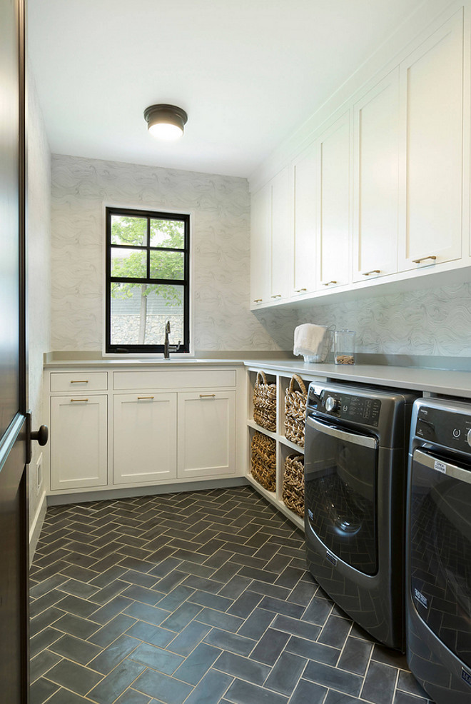 Custom handmade cement floor tiles laid in a herringbone pattern. Laundry room herringbone pattern tile. Custom handmade cement floor tiles. #Laundryroom #herringbonetile #Custom #handmade #cementfloortiles 