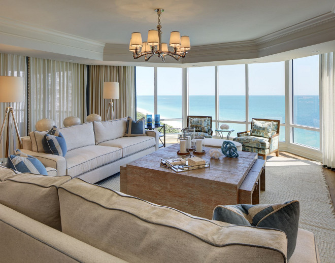 Living room with sheer draperies. Gorgeous oceanfront living room with sheer draperies and Ralph Lauren woven sea grass table. #livingroom #oceanfront #sheerdraperies