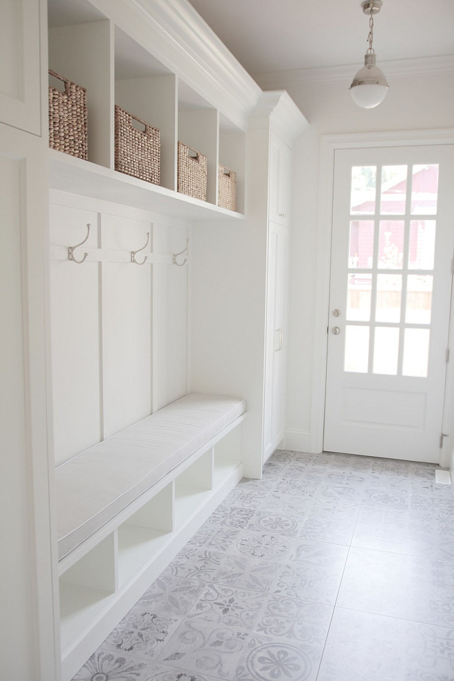 Mudroom with cement tile. White Mudroom with light grey cement tile. Everything was impeccably designed in this mudroom, but what really catches your attention is the cement flooring. Mudroom with cement tile. #MudroomcementTile #Mudroom #cementTile jshomedesign