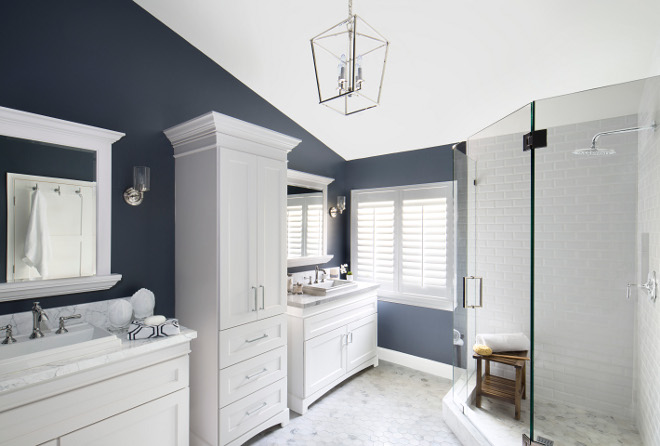 Navy and white bathroom. Bathroom with navy blue walls and white cabinets and white tiles. Navy and white bathroom #Navybathroom #whitebathroom #navyandwhitebathroom Lisa Michael Interiors