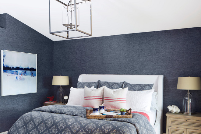 Navy wallpaper. Bedroom navy wallpaper. Adding a navy wallpaper in a bedroom creates coziness. The master bedroom features a navy wallpaper; a Phillip Jeffries Blue Barogues wallpaper, which beautifully contrasts with a white upholstered bed. #Navywallpaper #navy #wallpaper #bedroom Lisa Michael Interiors