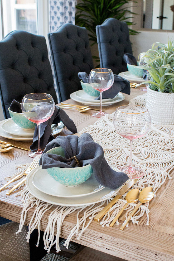 Table Setting Tips. Look for textures and tones around the room that you can incorporate into your table setting. We played off the navy dining chairs and brought in solid, charcoal napkins to add another layer of depth on the table. We used brass napkin rings to play off the silverware and keep things clean and consistent. Table Setting Tips #TableSetting #Tips 
