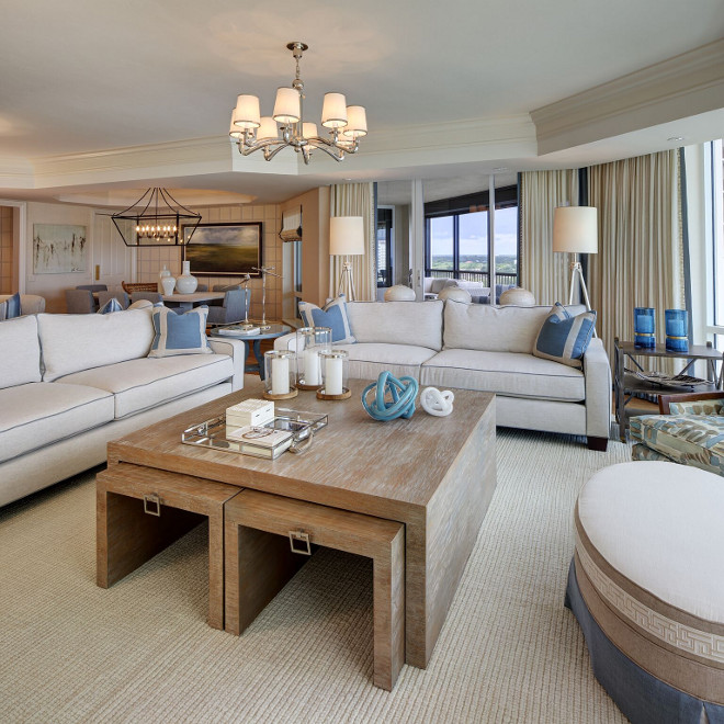 The living room features custom stained coffee table with small tables tucked under for extra surface space adorned with nickel hardware. #Livingroom #cocktailtable #coffeetable #whitewashed #whitewashedcoffeetable