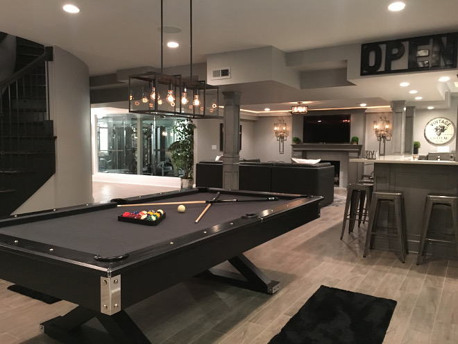 Basement Pool Table/Ping Pong Conversion table and Dart Board: Jaxxon Game Table by American Heritage. Pool table light fixture is by Trans Globe. Beautiful Homes of Instagram Sumhouse_Sumwear