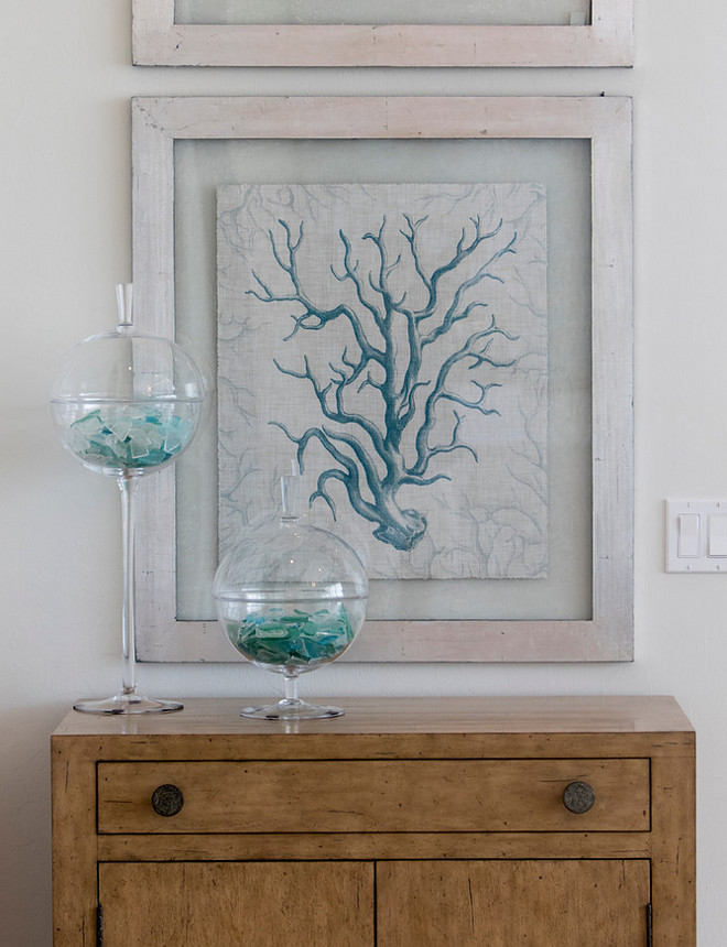 Coastal Foyer. Foyer coastal decor. A modern rustic feel is artfully implemented into a classic coastal design with natural distressed wood finishes. These prints were custom framed by Robb & Stucky.