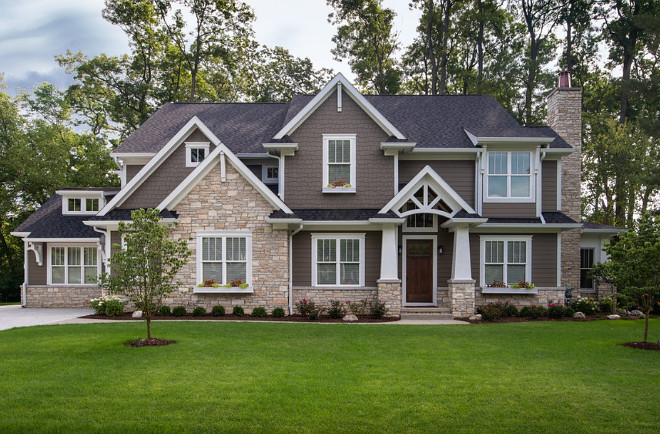 Dark brown home exterior paint color. Dark Brown Exterior with White Trim & Stone. The siding is James Hardie, Precolored Harder, color Timberbark. The shingles are from Landmark Pro, Max Def, Black Walnut. Stone is Fond Du Lac Rustic by Halquist with 4" limestone brick ledges. dark-brown-home-exterior-paint-color