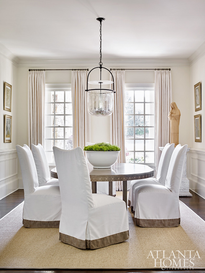 Dining Room. Custom slipcovered chairs and an expanding dining table from Bungalow Classic lend themselves to gatherings during holidays or special occasions #Diningroom Beth Webb Via Atlanta Homes magazine