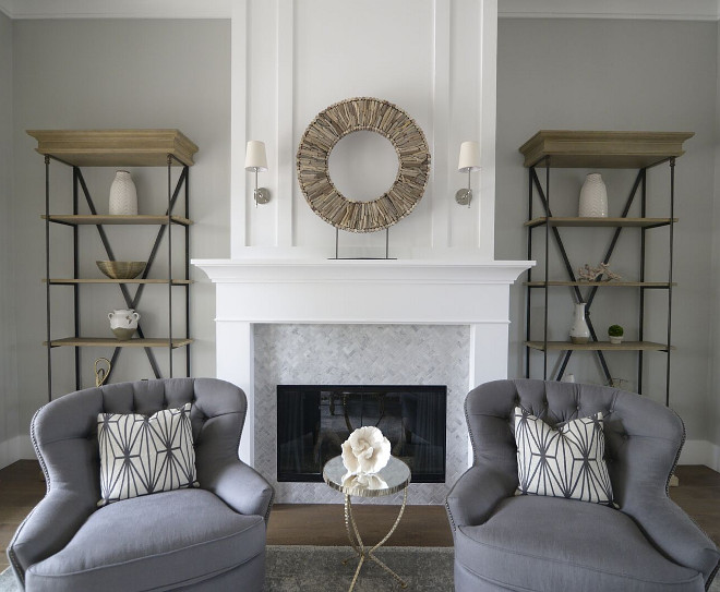 Grey wall paint color with white trim. Wall paint color is Behr Dolphin Fin. Fireplace and trim paint color is Benjamin Moore Simply White OC-117. #Greywall #paintcolor #whitetrim #paintcolors #colorpalette #BenjaminMooreSimplyWhite #BehrDolphinFin Eye for the Pretty