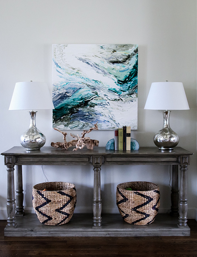 Console table. Baskets under console table are Nate Berkus for Target. Lamps: Ballard Designs. #ConsoleTable #lamps #baskets #art #decor foyer-console-table-decor Home Bunch's Beautiful Homes of Instagram curlsandcashmere