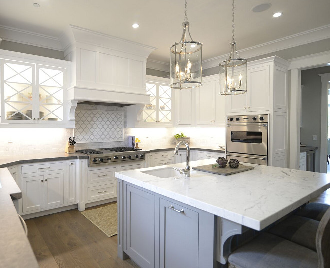 Kitchen. This kitchen is truly impressive! I love the crisp white cabinets with the grey walls and grey kitchen island. Wall paint color is Behr Dolphin Fin. Lights are Lara Pendant via Joss and Main Polished Nickel. #whitekitchen #kitchen #whitekitchens #Behrdolphinfin Eye for the Pretty 