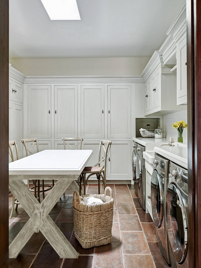 laundry-room-laundry-room-features-custom-x-leg-table-for-folding-custom-cabinets-farmhouse-sink-and-2-washers-2-dryers The Refined Group.
