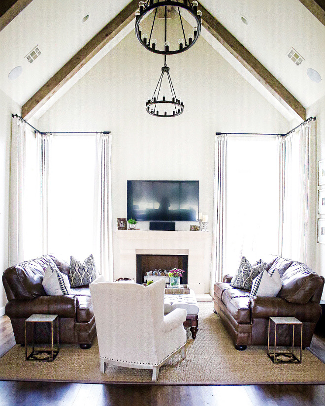 The floor to ceiling windows let in so much light into this room, I just love it. The vaulted ceiling with beams adds just the right amount of interest and elegance to this space. living-room-ceiling Lighting: Hinkley. Home Bunch's Beautiful Homes of Instagram curlsandcashmere