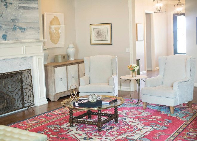The small accent table between the chairs is from Gabby Home and can be purchased through Ivy House. The foyer can be seen straight ahead behind the chairs. Ivy House Interiors