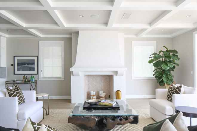 Living room coffered ceiling and white stucco fireplace. Neutral Living room coffered ceiling and white stucco fireplace. More details on the stucco fireplace and on the coffered ceiling on the blog. #Livingroom #cofferedceiling #whitestucco #stuccofireplace Winkle Custom Homes. Melissa Morgan Design. Ryan Garvin Photography