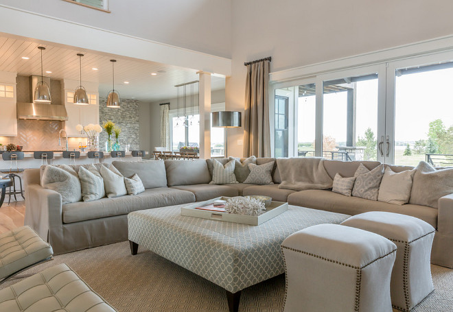 Neutral Living room. Sophisticated but comfy living room featuring RH Belgian Linen slipcovered sectional, custom ottoman in Thibaut geometric, Gabby Decor ottomans, and wool rug by Curran. Custom window treatments in Lee Jofa's Suzanne Kasler fabric. Neutral Living room furniture. Neutral Living room. Neutral Living room #NeutralLivingroom #Neutral #Livingroom neutral-living-room Restyle Design, LLC.