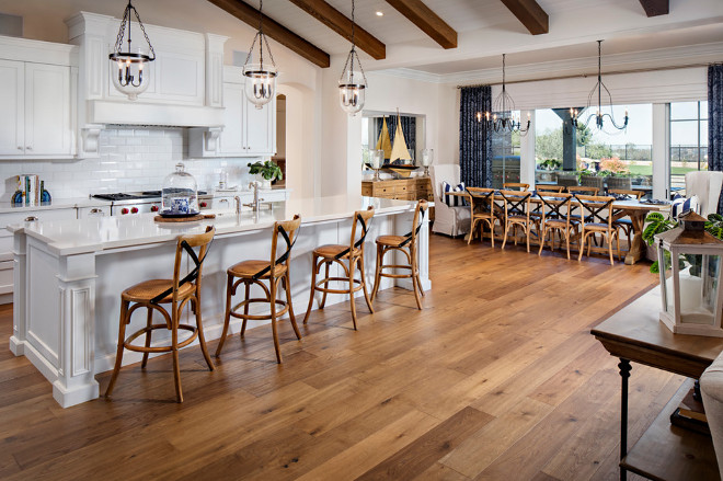 Open kitchen with hardwood flooring. The kitchen hardwood flooring is Carlton Landmark Collection White Oak Sherwood. #kitchen #hardwoodflooring Tracy Lynn Studio