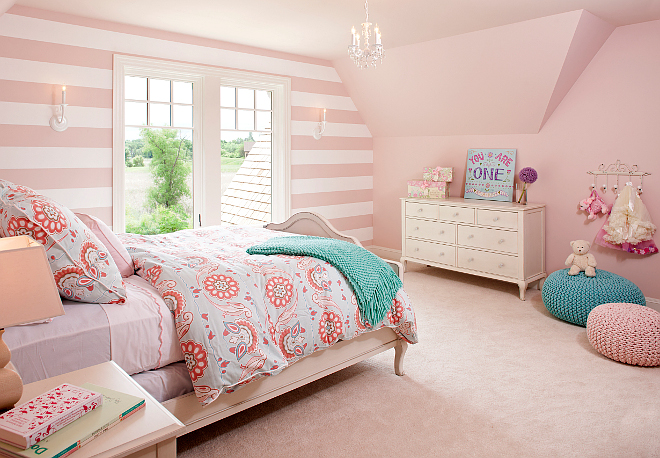 This pink girl's bedroom is so sweet! Walls are covered in a Serena & Lily Stripe Wallpaper and the pink paint color was custom to match the wallpaper. Lighting is Crystorama. pink-stripes-in-girls-bedroom #girlsbedroom #pinkgirlsbedroom Vivid Interior Design. Hendel Homes