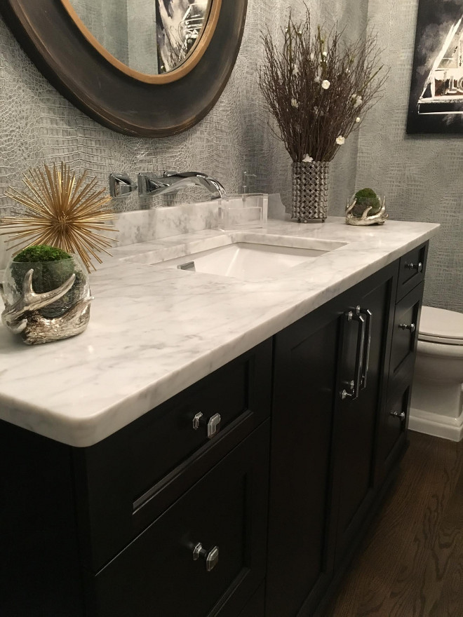 Powder room Dark Cabinet and honed marble countertop. Countertop is Honed Carrara Marble from MS International, Inc. Sink is Toto. . Beautiful Homes of Instagram Sumhouse_Sumwear