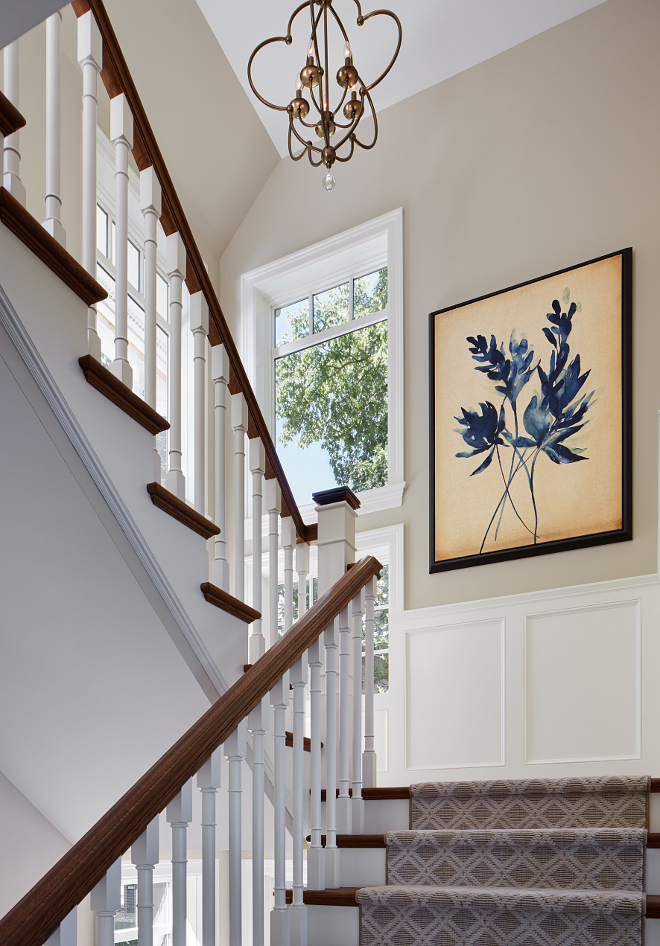 Stair paint color. Stair millwork paint color. Stair paint color is Sherwin Williams SW 7036 Accessible Beige. Wainscotting paint color is Benjamin Moore White Dove. sherwin-williams-sw7036-accessible-beige-wall-paint-color-wainscotting-paint-color-is-benjamin-moore-oc-17-white-dove #Stair #paintcolor #Stairmillworkpaintcolor #Stairpaintcolor #SherwinWilliamsSW7036AccessibleBeige #Wainscotting #BenjaminMooreWhiteDove Vivid Interior Design. Hendel Homes