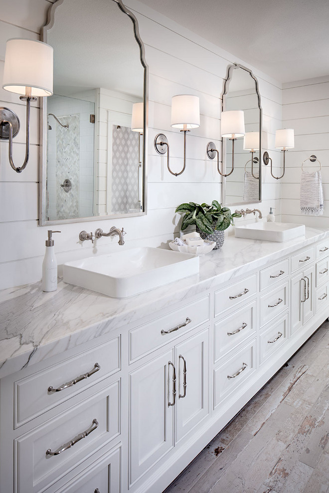 Shiplap bathroom wall with white cabinetry, white marble countertop, wall mount faucet and rustic looking floor tile. #Shiplapbathroom #bathroom #Shiplapwall #whitecabinetry #whitemarblecountertop #wallmountfaucet #rusticlookingfloortile shiplap-bathroom-wall-with-white-cabinetry-and-rustic-looking-floor-tile Tracy Lynn Studio