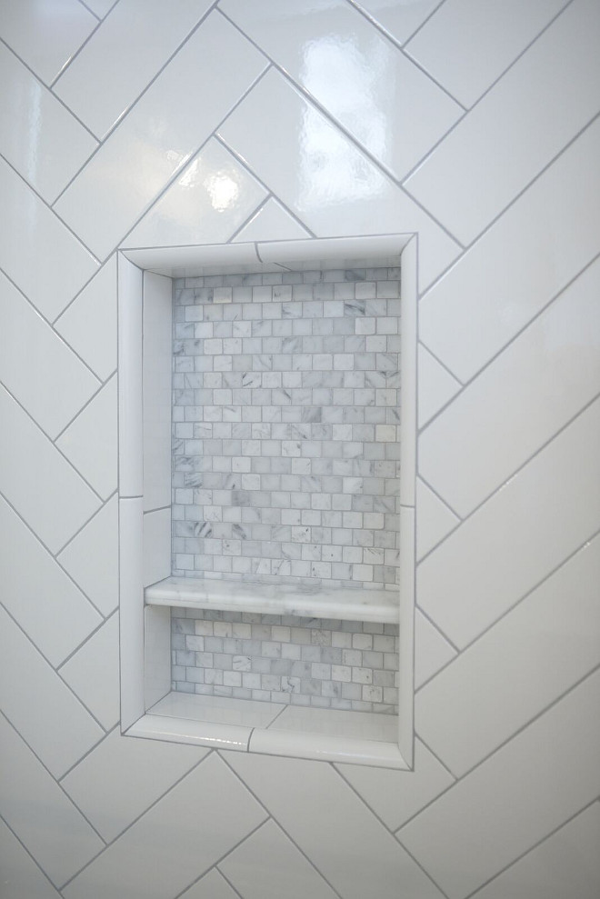 Shower niche. The shower niche features marble mosaic tile. #showerniche #showernichetie shower-niche