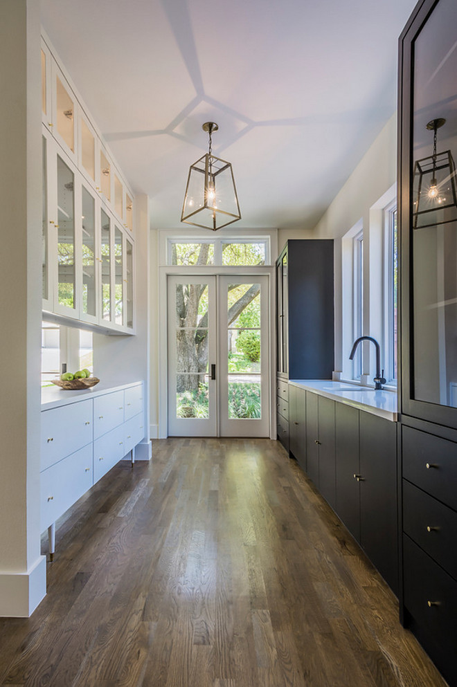 Tricorn Black by Sherwin Williams. Dark cabinet paint color. This particular cabinet in the butler pantry was done with a satin finish Tricorn Black by Sherwin Williams. #TricornBlack #SherwinWilliams #Darkcabinet #paintcolorTANNER HOMES & TIPER