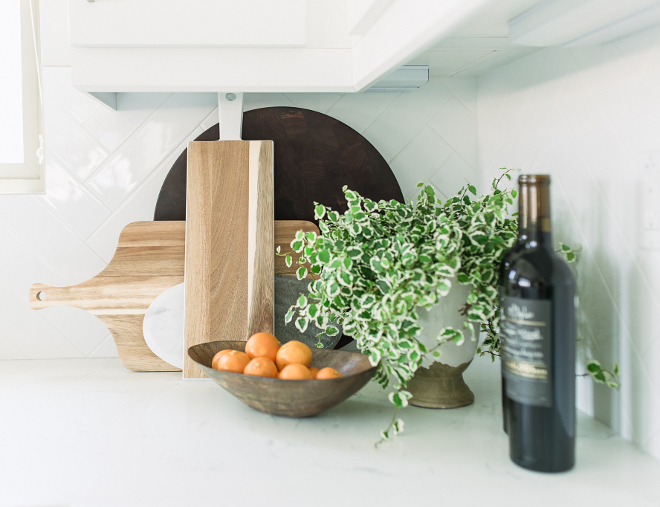 Wood and Marble on kitchen countertop. New kitchen trend. One of the latest kitchen trends is stacking wood and marble boards on the countertop. They add texture and a casual look to any kitchen #kitchen #kitchentrends #woodboard #marbleboard Pure Salt Interiors