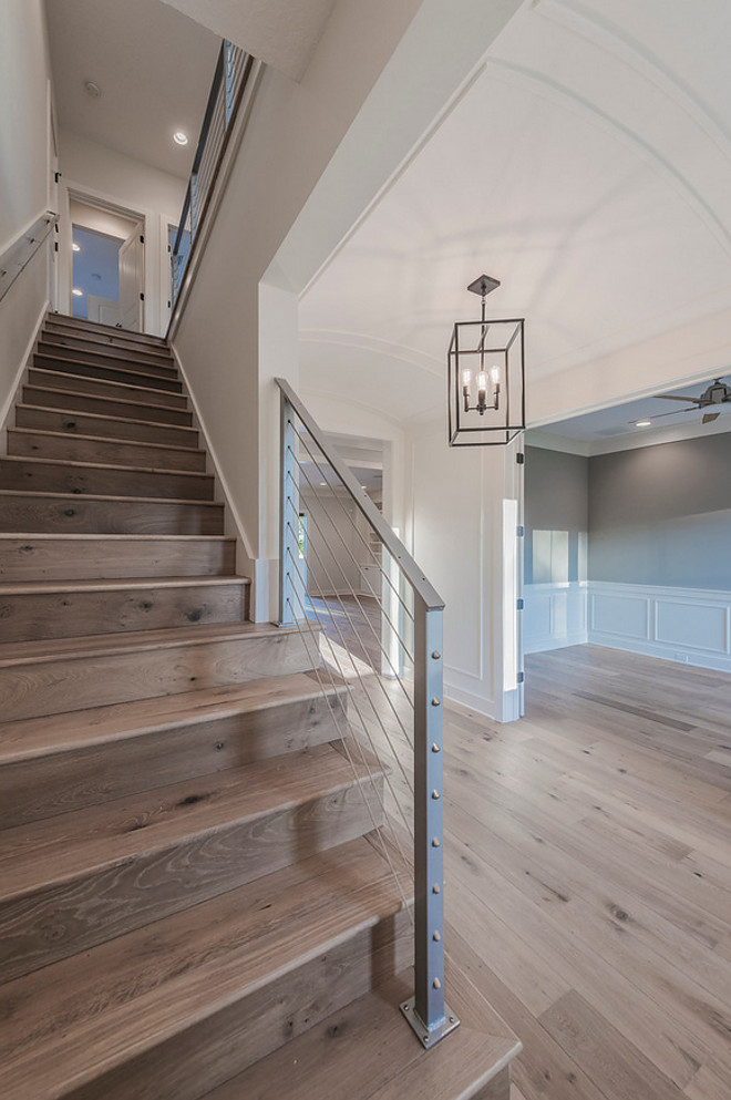 Barrel Ceiling Foyer with steel cable railing staircase and wide plank oak floors. Floor is Chesapeake Flooring White Oak, Provence Manor Outback. barrel-ceiling-foyer-with-stainless-cable-railing-staircase-and-wide-plank-oak-floors #BarrelCeiling #BarrelCeilingFoyer #Foyer #steelcablerailing #staircase #wideplank #oakfloors Cottage Home Company