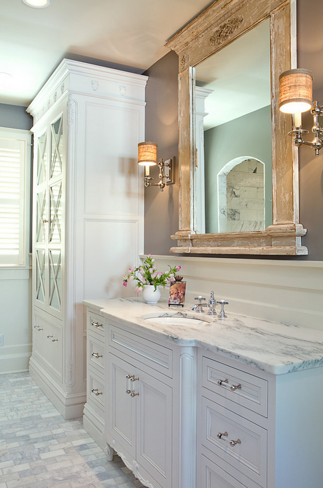 Bathroom Distressed Mirror. Flawless white master bathroom suite. Custom tall linen storage, rustic mirror, white inset cabinetry, and marble countertop. #bathroom #reclaimedwoodmirror #Bathroommirror bathroom-distressed-mirror