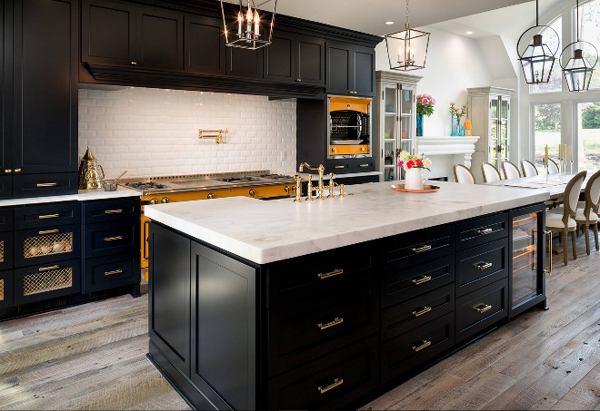 Black kitchen cabinets. Black kitchen cabinets. Black kitchen cabinets with white marble countertop and rustic wide plank wood floor. #Blackkitchen #Blackkitchencabinets black-kitchen-cabinets #rusticwood #rusticwoodfloor #reclaimedwoodfloor Marc Levack. Deborah Scannell Photography
