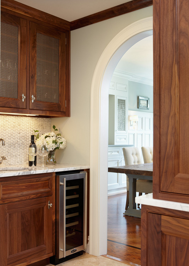 Butler's pantry. Butlers pantry cabinet. Butlers pantry cabinet and archway. #Butlerspantry #cabinet #Butlerspantrycabinet butlers-pantry Merrick Construction, Inc.