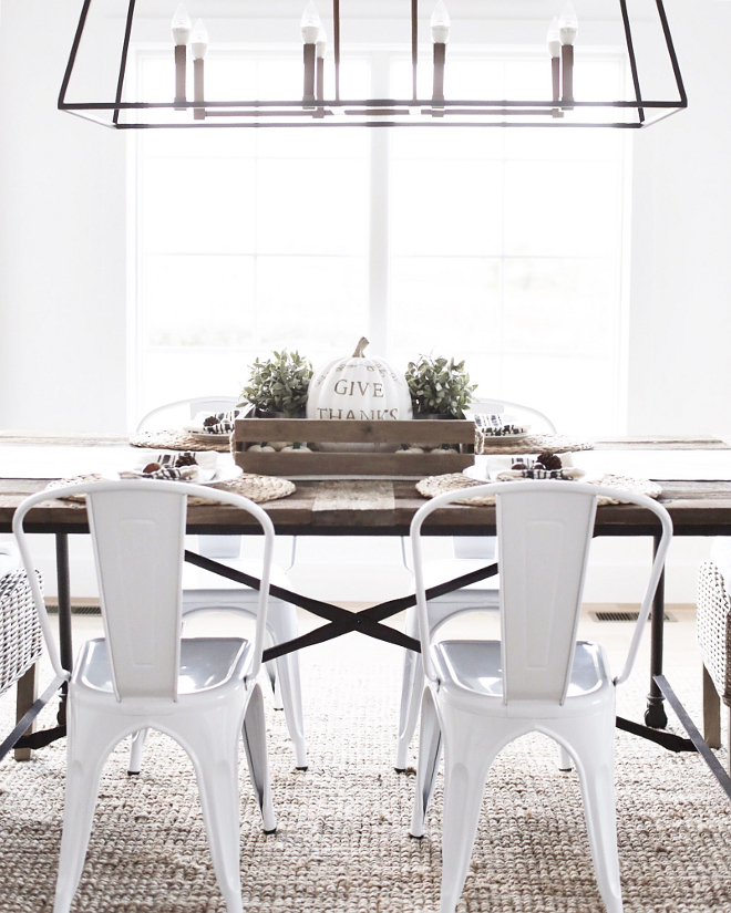 The Tolix style white chairs are from Walmart. Farmhouse dining room with Tolix style white chairs are from Walmart. #farmhouse #tolixstylechairs #whitetolix Beautiful Homes of Instagram @nc_homedesign via Home Bunch