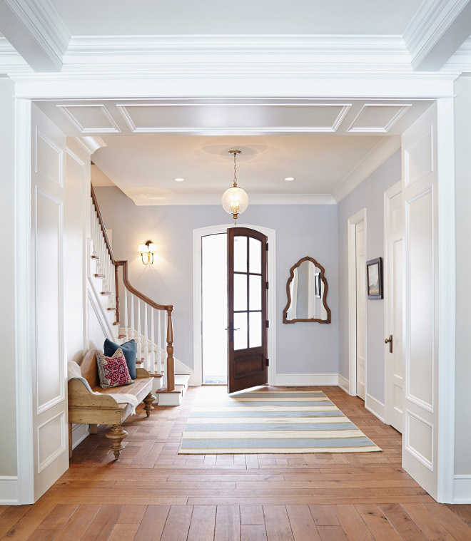Foyer. This crisp foyer is painted in Gray Screen by Sherwin Williams and the millwork is painted in Icicle by Benjamin Moore. #Foyer #Millwork #paintcolor #GrayScreenSherwinWilliams #IcicleBenjaminMoore foyer Hendel Homes