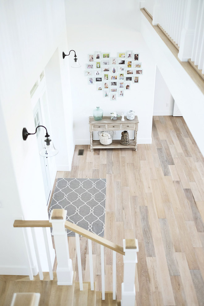 Farmhouse Foyer. Farmhouse foyer flooring. The foyer, like the rest of the house, feels bright and uncluttered. Hardwood flooring is from Phillips Floors. #Farmhouse #Foyer #Farmhousefoyer #flooring Beautiful Homes of Instagram @nc_homedesign via Home Bunch