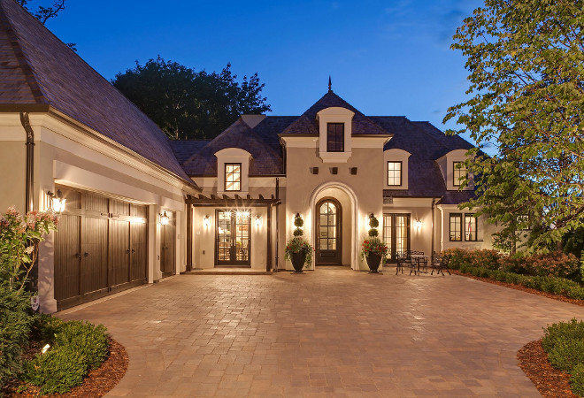 French Home Exterior. This French home has an incredible curb-appeal! I love the slate roof and the wood garage doors. #Frenchhome #Frenchhomeexterior #homeExterior french-home-exterior-ideas Hendel Homes