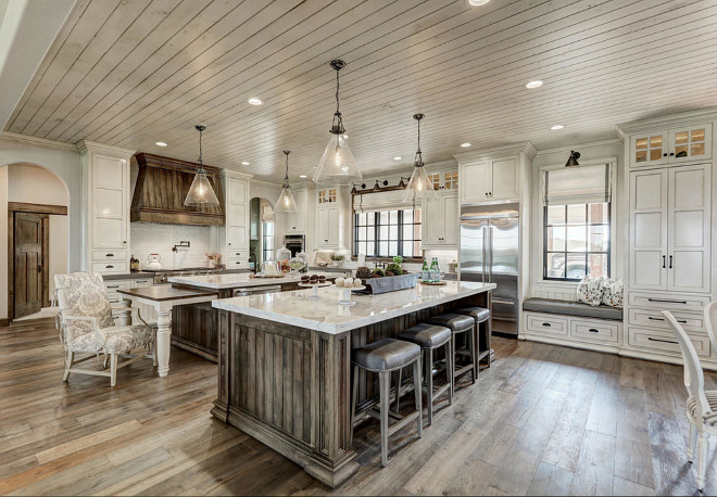 KItchen window seat. Kitchen features window seat flanked by cabinets. #kitchen #windowseat kitchen-window-seat-flanked-by-cabinets Alicia Zupan