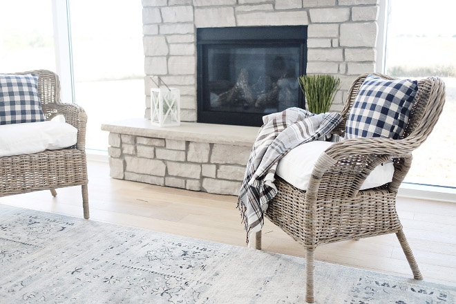 Living room chairs. Comfy wicker chairs add some texture and comfort by the stone fireplace. #livingroom #chairs #wickerchairs #wicker #livingroomchairs Beautiful Homes of Instagram @nc_homedesign via Home Bunch
