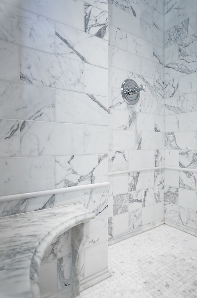 Marble Shower. Large walk-in shower featuring marble subway tile, a corner marble shower seat, and basketweave flooring. marble-shower #marbleshower #walkinshower #shower #largeshower #showerbench #showerseat Karr Bick Kitchen and Bath