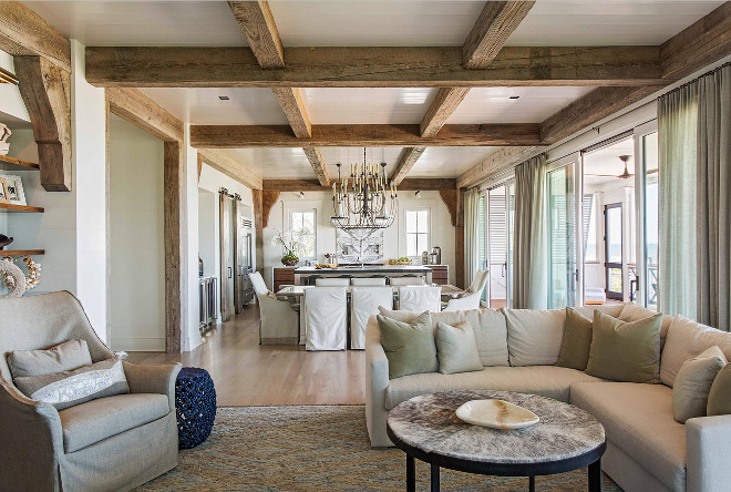 Reclaimed beams. Reclaimed beams continues from the kitchen to the living room area. Open layout with reclaimed beams. #Openlayout #reclaimedbeams #ceilingbeams Herlong & Associates Architects + Interiors