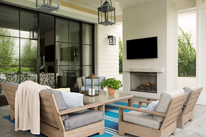 Outdoor patio with painted brick fireplace. Outdoor patio with painted brick fireplace in a soft, creamy white color. #Outdoor #patio #paintedbrickfireplace #softwhite #creamywhite Matt Morris Development