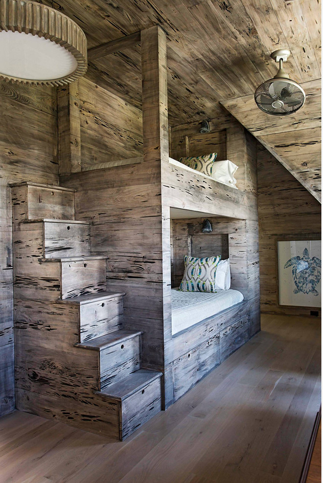 The bunk beds and stairs were custom designed and made of reclaimed Pecky Cypress wood. Rustic bunk beds. #bunkroom #pecycypress #rustic #bunkbeds #bunkroom pecky-cypress-bunk-room Herlong & Associates Architects + Interiors