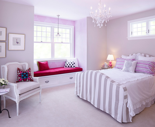 Pink Bedroom. The girl's bedroom has a built-in window seat and warm and colorful wallpaper creating a vignette the moment you walk in. Pink Bedroom. Pink Bedroom with striped gray bed. #PinkBedroom pink-bedroom Hendel Homes 