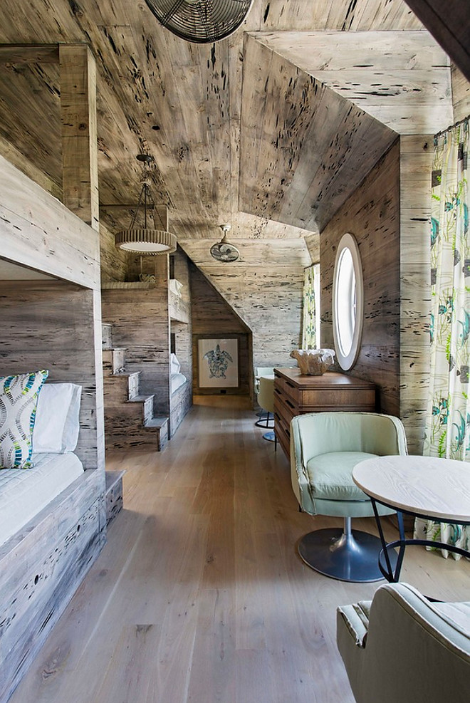 Rustic Bunk Room. Pecky Cypress wood creates a rustic look to this long bunk room. Pecky Cypress. #Rusticinteriors #PeckyCypress #Bunkroom #rusticbunkroom #bunk rustic-bunk-room-with-pecky-cypress-wood Herlong & Associates Architects + Interiors