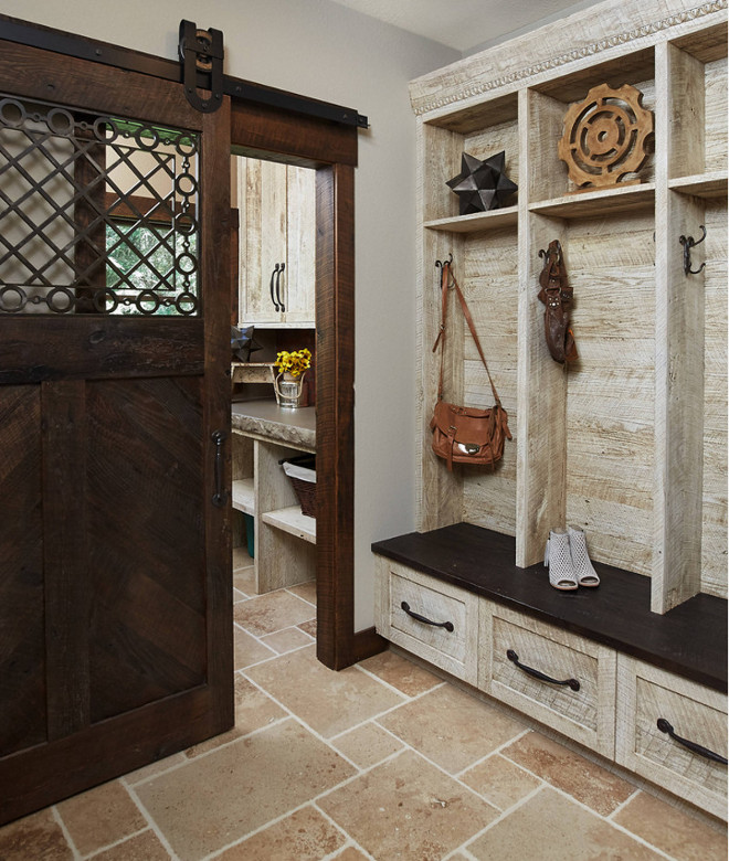 Rustic mudroom. Rustic mudroom with barn hand hewn and rough sawn wood cabinet and shiplap. Notice the incredible design on the barn door. Rustic mudroom with #barn hand hewn and rough sawn wood #cabinet and #shiplap. Notice the incredible design on the #BarnDoor. #Design by @mikeschaapbuilders and Benchmark Wood Studio Inc. #Pic by @ashleyavilaphotography. rustic-mudroom