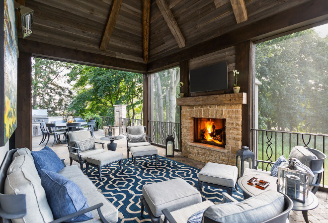 Screened in porch. Screened in porch. Screened in porch with fireplace and reclaimed wood ceiling. Screened in porch. #Screenedinporch #fireplace #reclaimedwoodceiling #reclaiedwood screened-in-porch Hendel Homes