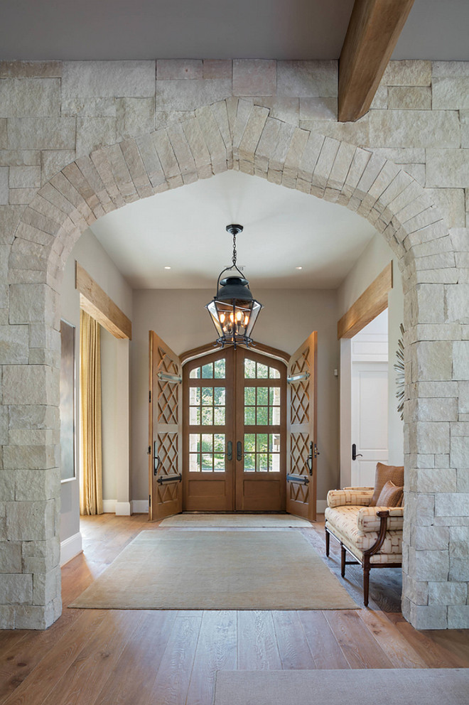 Stone Archway. Foyer with stone archway. The foyer features a timeless stone archway. The stone was purchased from Alamo Stone and is called "White Chopped" stone. #Stonearchway #stone #archway #whitechoppedstone #choppedstone Allan Edwards Builder Inc